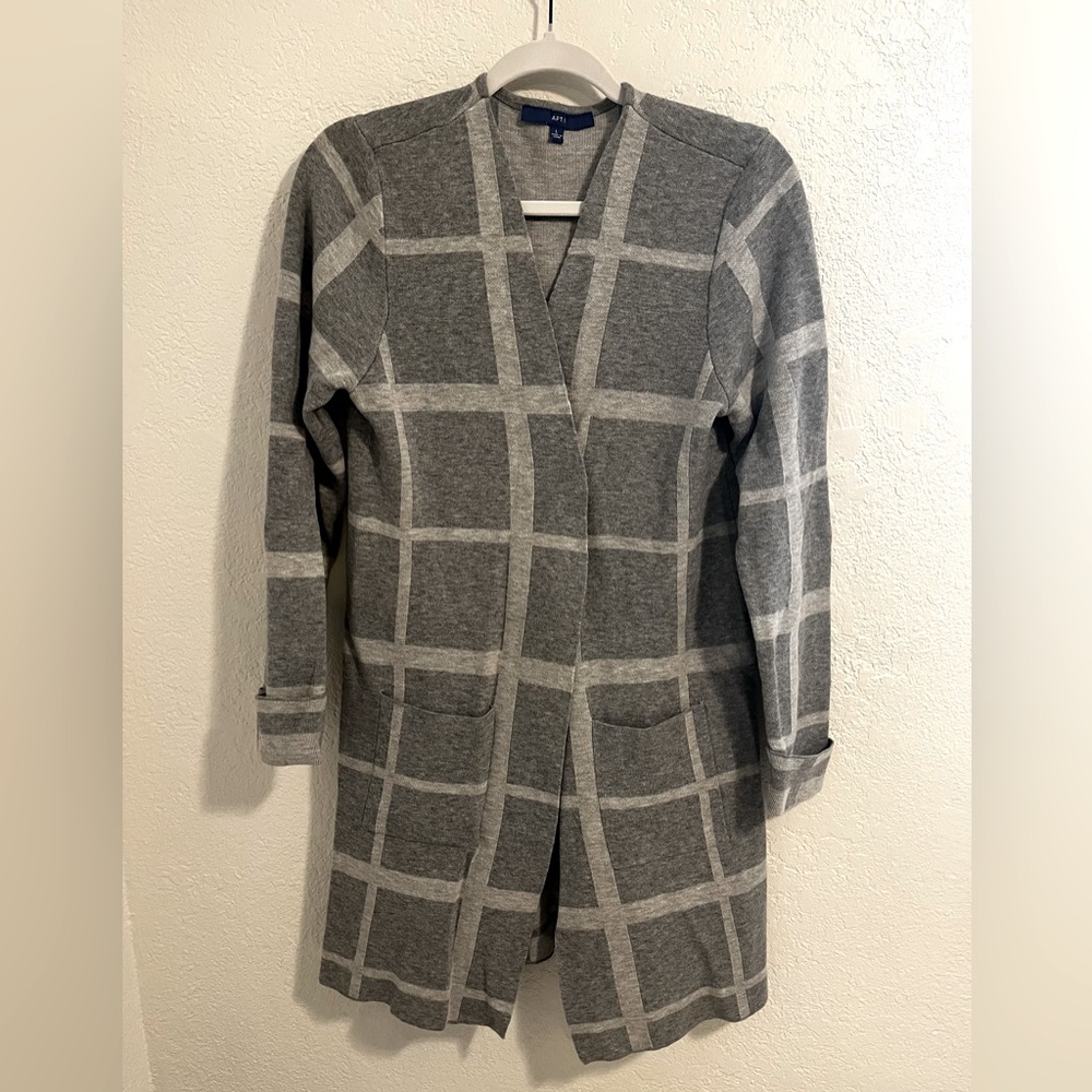 Long sleeve, mid length gray sweater.